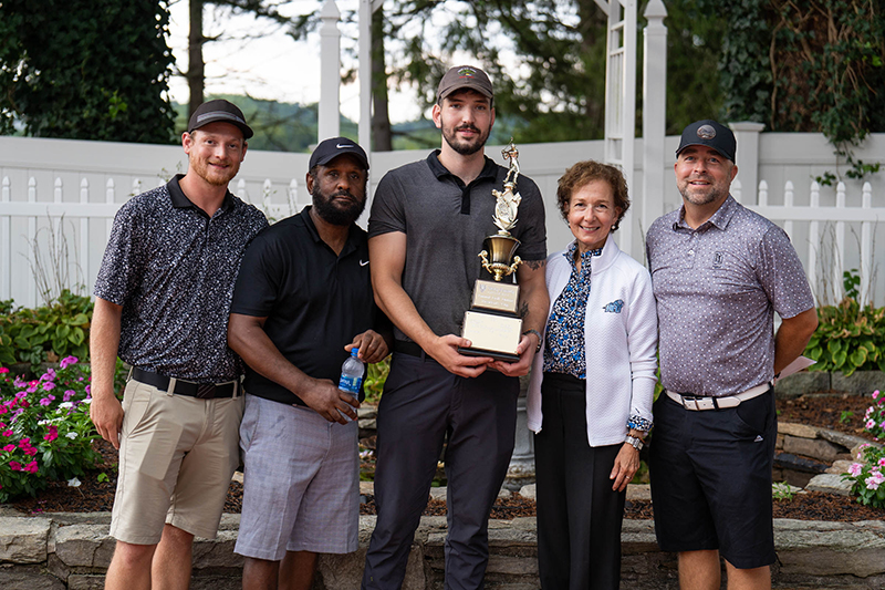 Dr. Anne Prisco presented Evolution Sustainability Group players Chris McCleerey, Darrell Ballard, Andrew Harkness, and Doug Chizmar with the President’s Cup for the team with the lowest score.