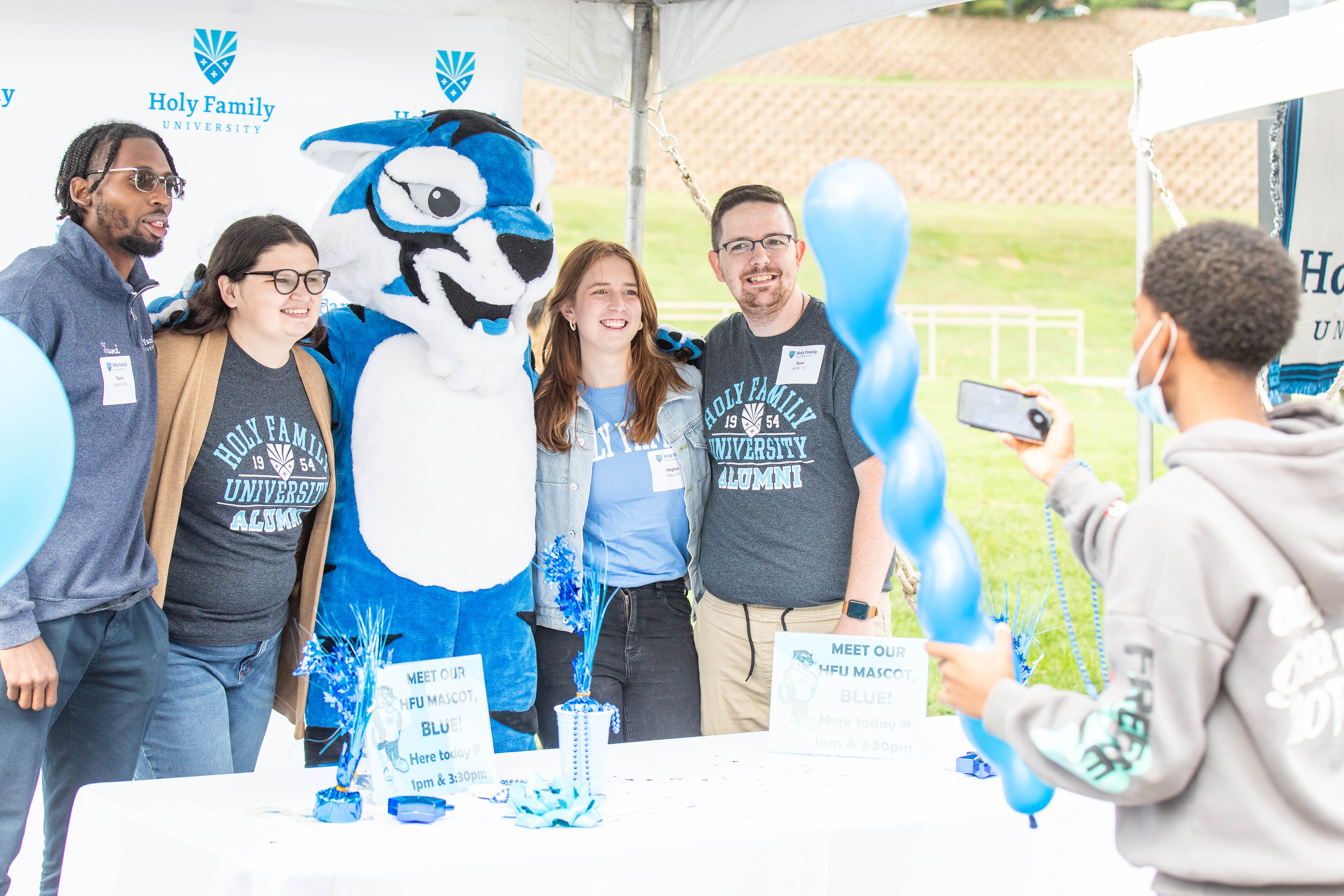 51573471821_ce8f2aeb29_o.jpg Alumni pose with Blue the Tiger