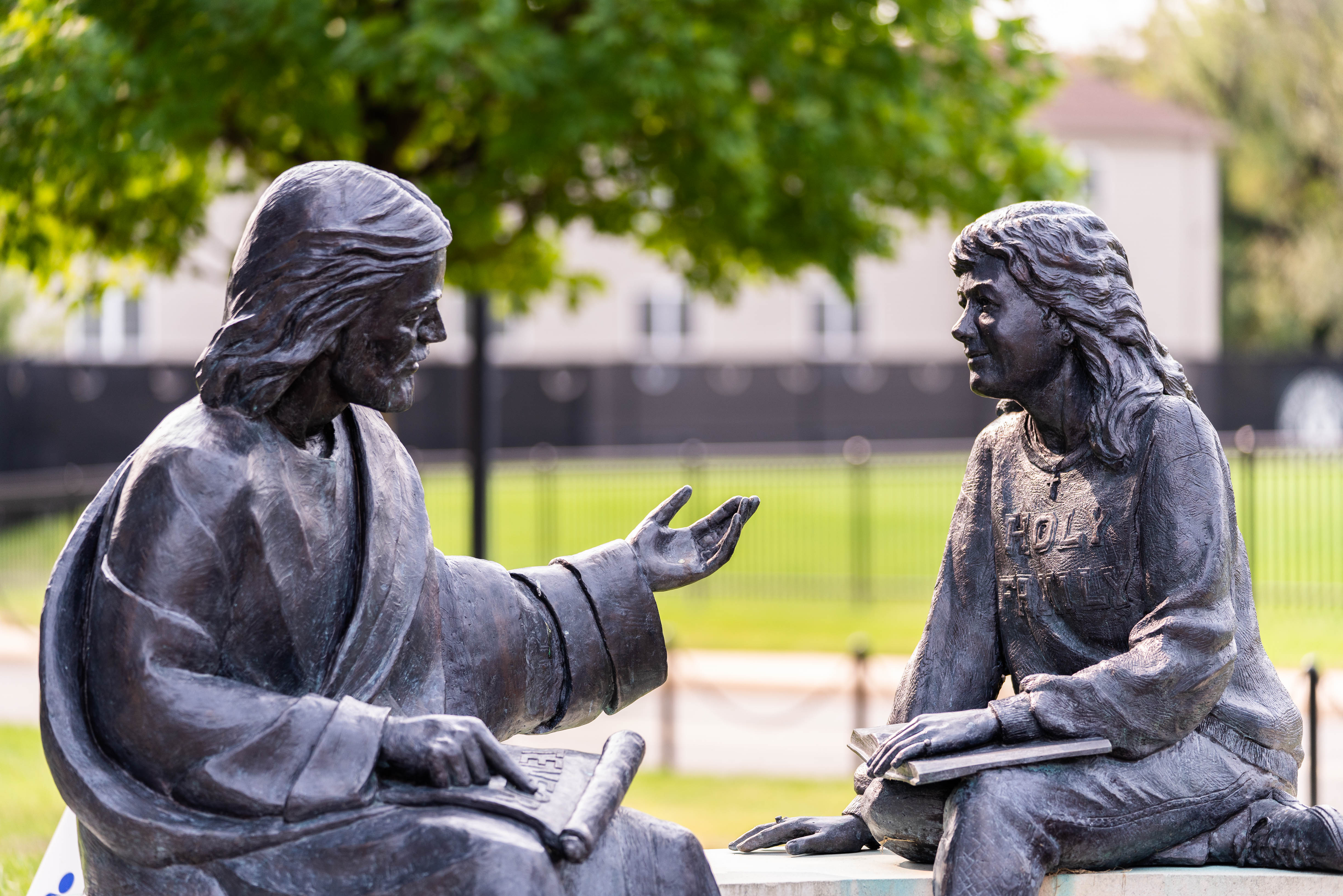 Spiritual Life-HFU Environmental-113-September 16, 2020.jpg Bench featuring Jesus talking with a Holy Family University student