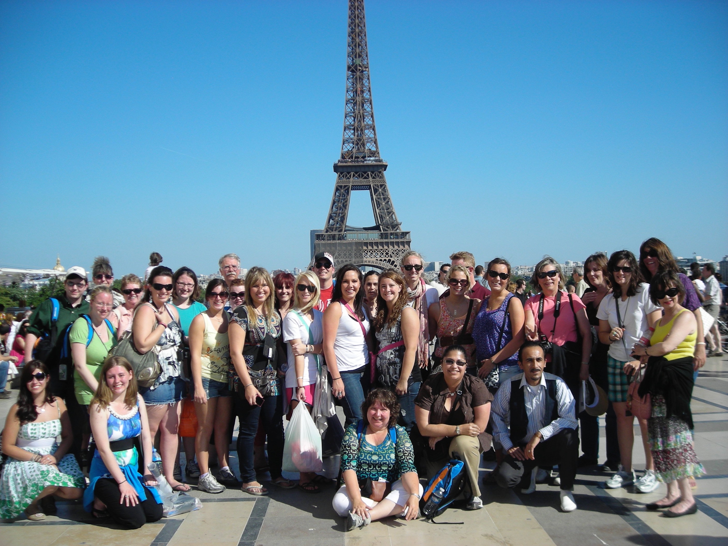 Holy Family University students post in front of the Eiffel Tower in Paris, France