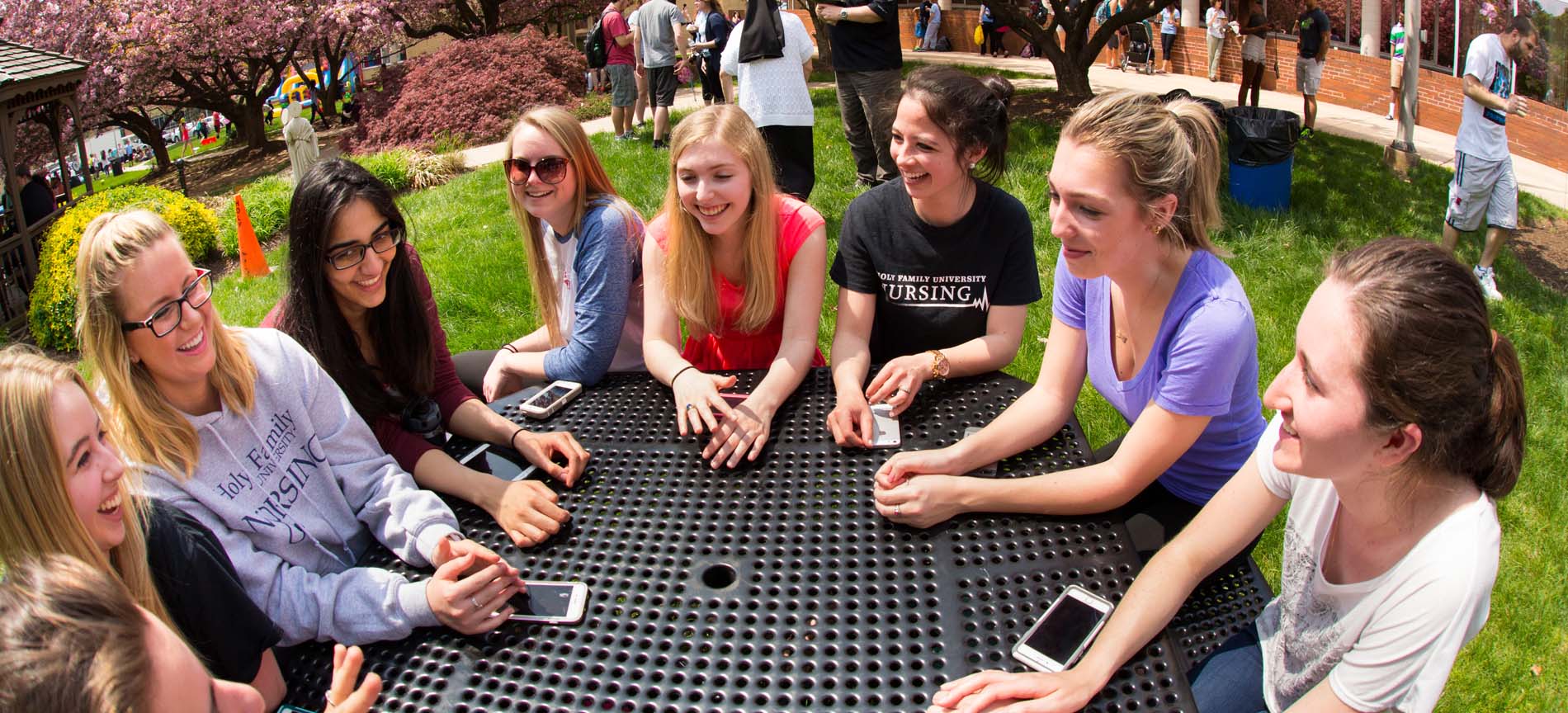 Girls sitting outside at a round table