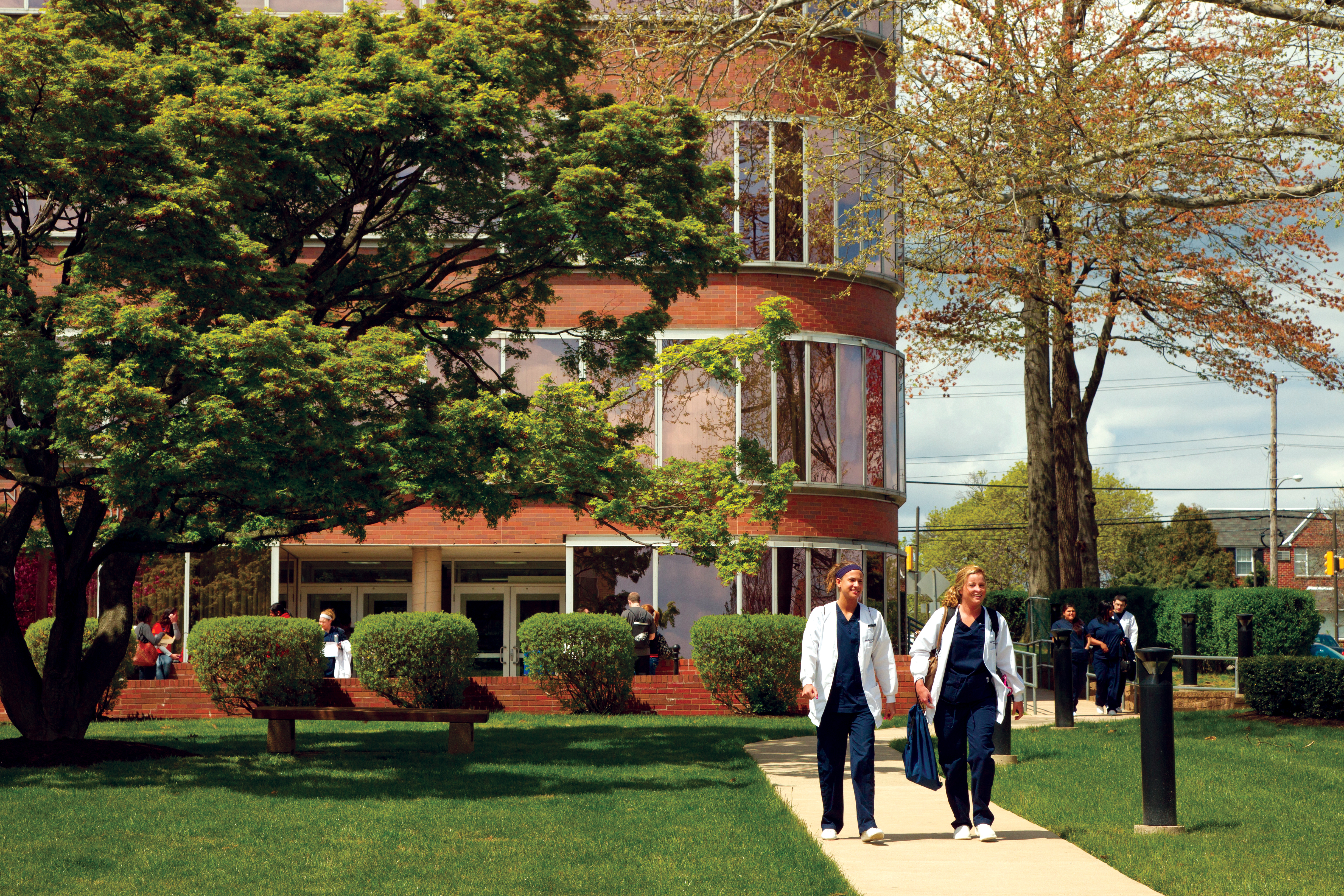 2 Girls walking outside Nursing Building