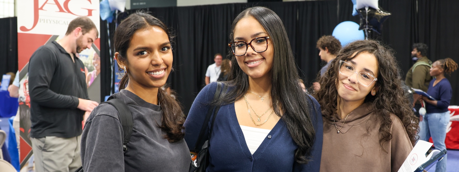 Three students attending campus career fair