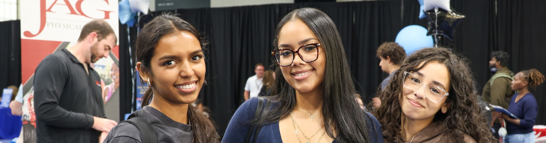 Three students attending campus career fair