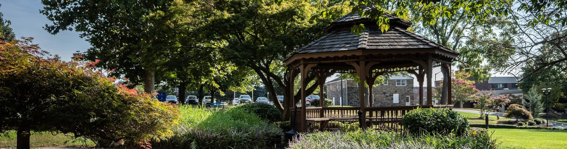HFU campus path with gazebo on right and shrubs and trees on left