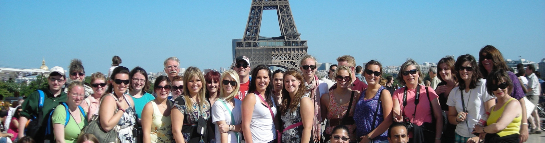 Holy Family University students post in front of the Eiffel Tower in Paris, France