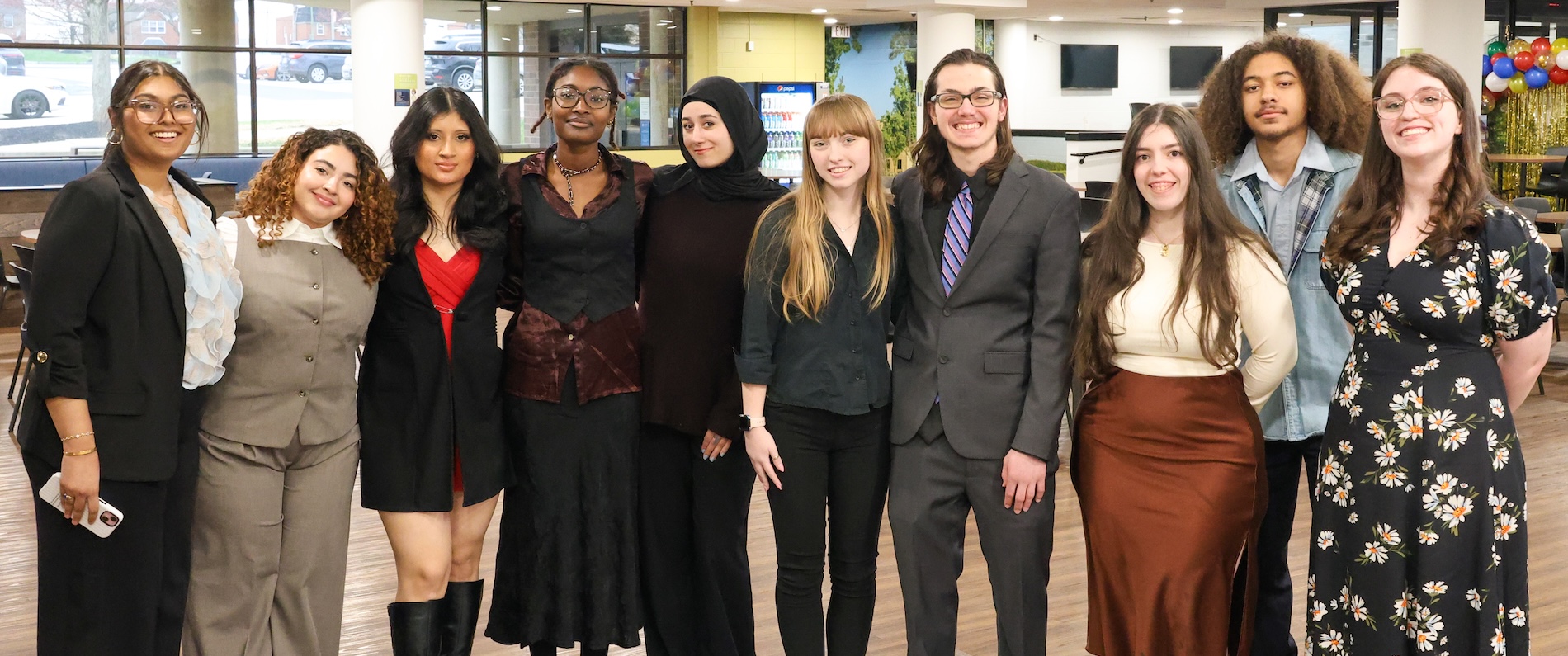 A group of Holy Family students in formal dress at a campus event