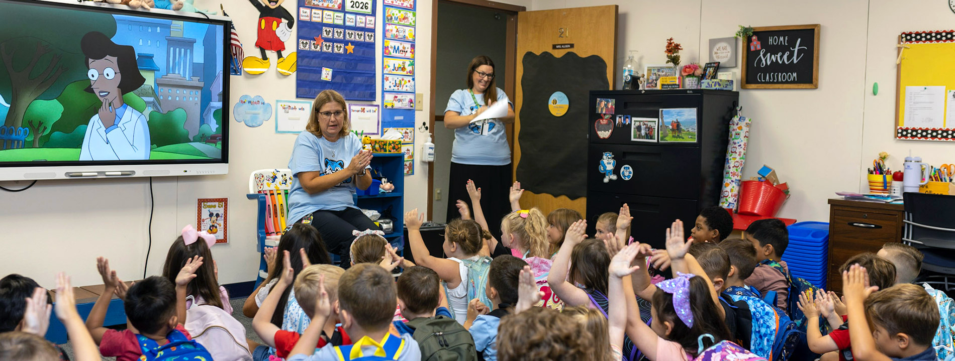 Alpha House teachers interacting with students.