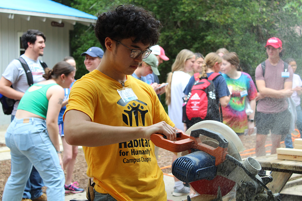 A contingent of 23 Holy Family students and faculty volunteering at a building site in Florida during spring break.