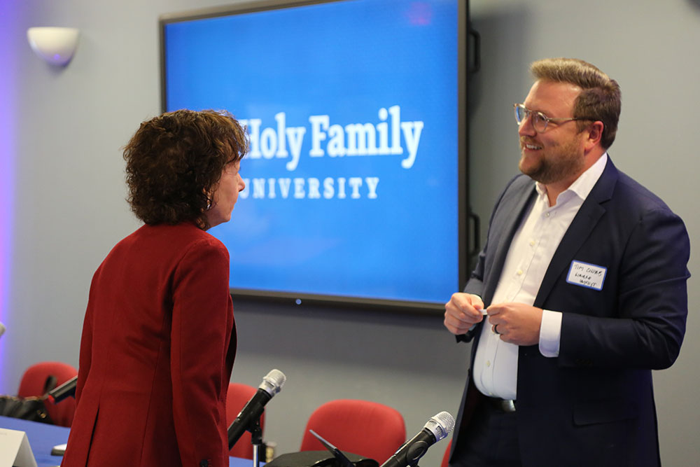 Dr. Prisco speaking to an event attendee