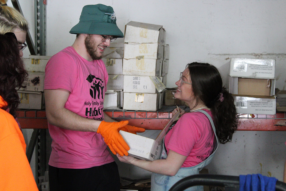 A contingent of 23 Holy Family students and faculty volunteering at a building site in Florida during spring break.