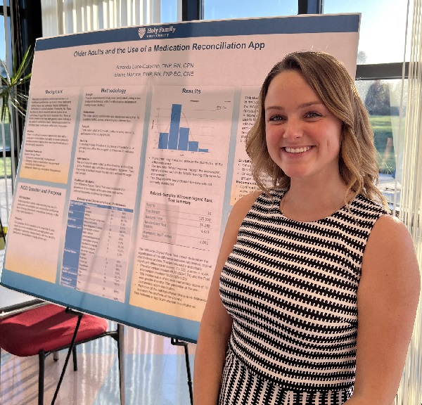 Amanda Luce-Caterino ’16, M’21, D’22 presents her poster on Older Adults and the Use of a Medication Reconciliation App at the DNP Poster Presentation event.