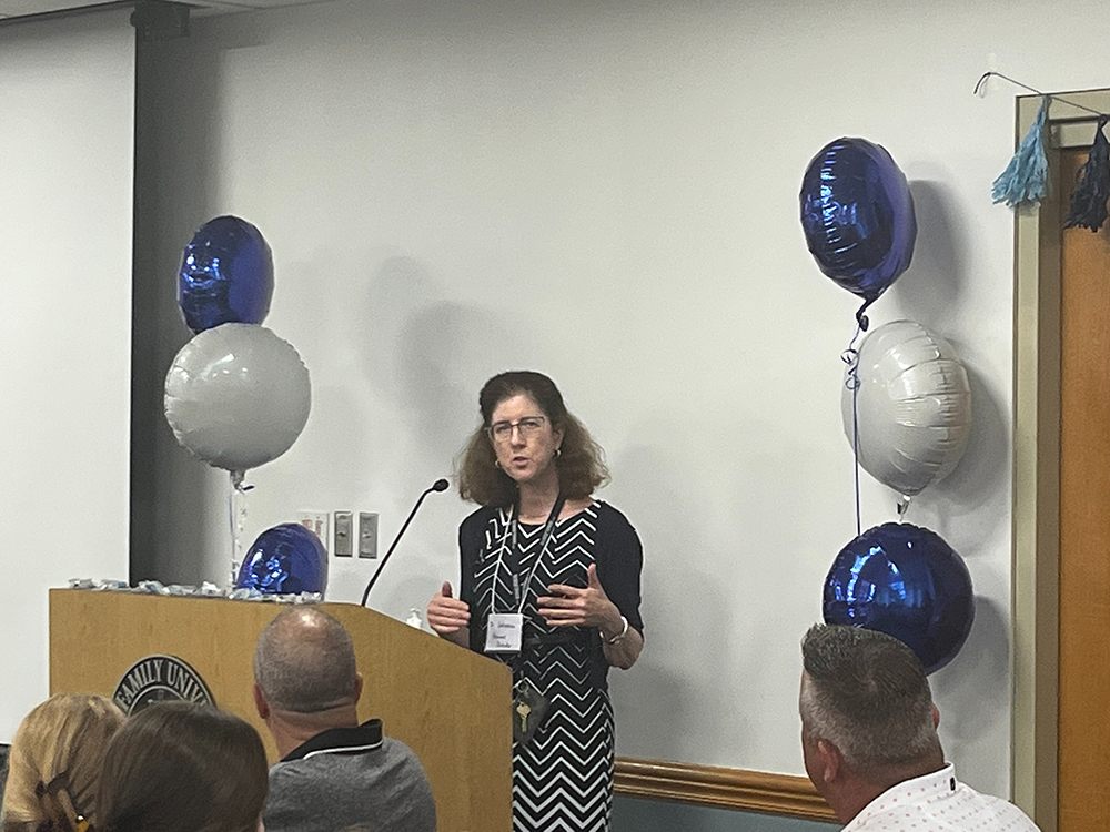 Dr. Mary Carroll Johansen speaking at event