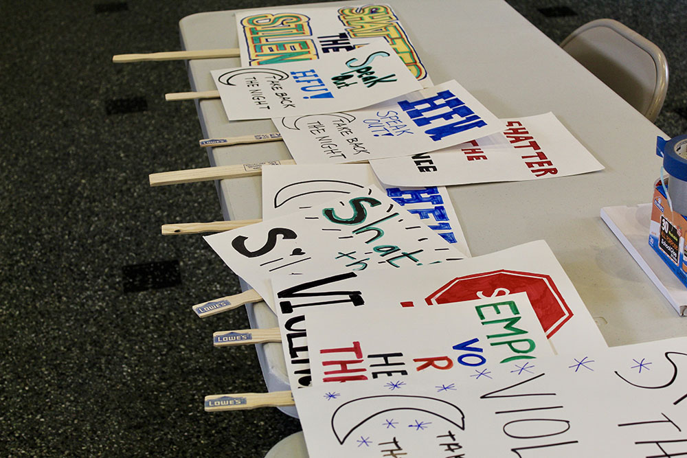 Collection of handmade signs from the Take Back the Night awareness event.