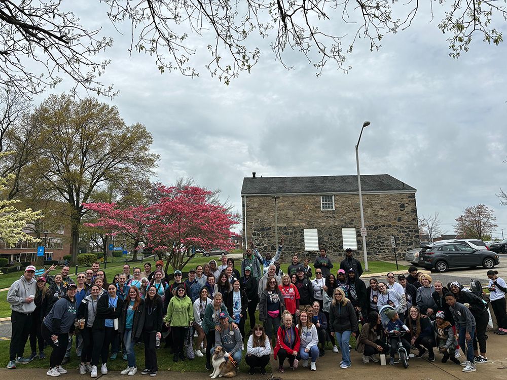 Students and community members participating in the Out of the Darkness Suicide Prevention Walk on campus.
