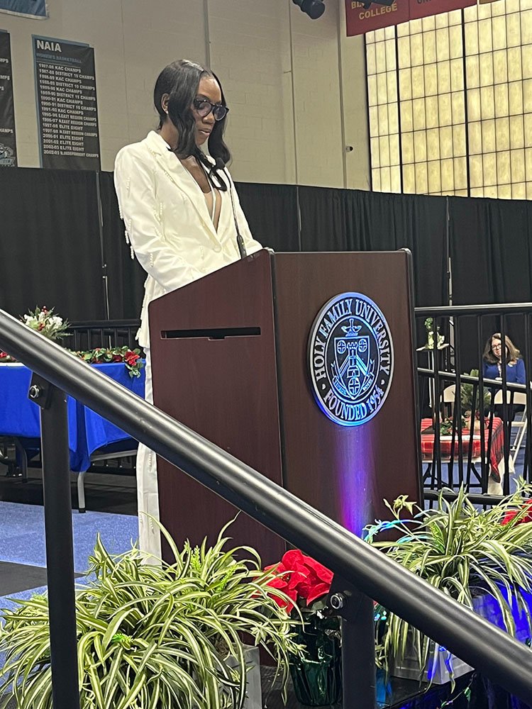 Graduate Kamilah A. Glenn delivering a reflection