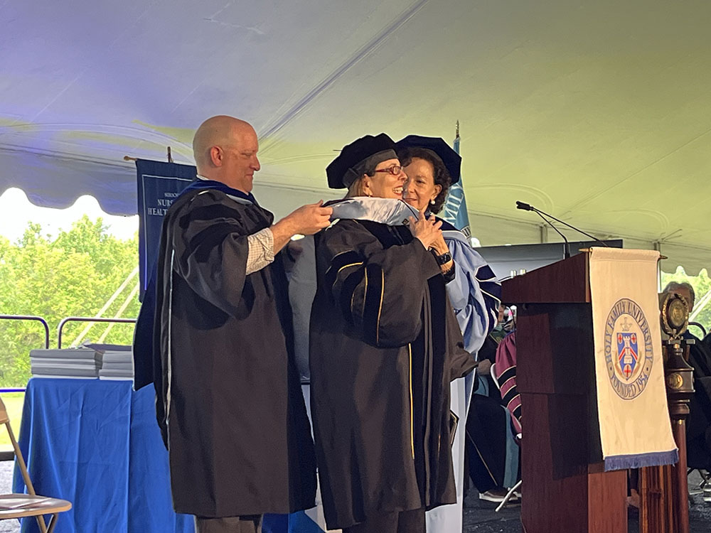 Student receiving honors at commencement ceremony
