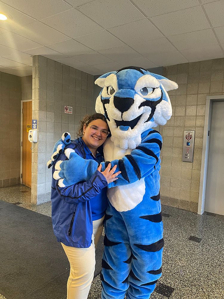Rosanna Mendez with mascot Blue