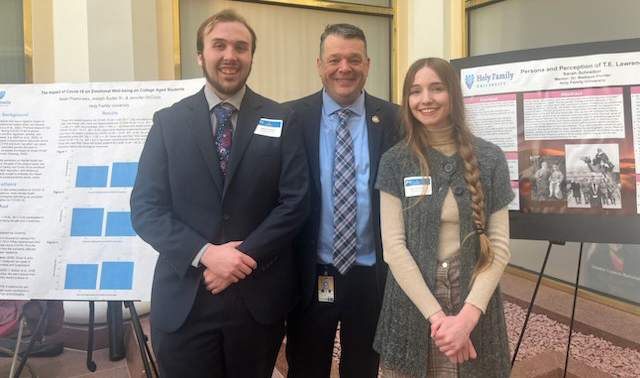 Sean Pramnieks '24 and Sarah Schreiber '24 present their research to Representative Pat Gallagher