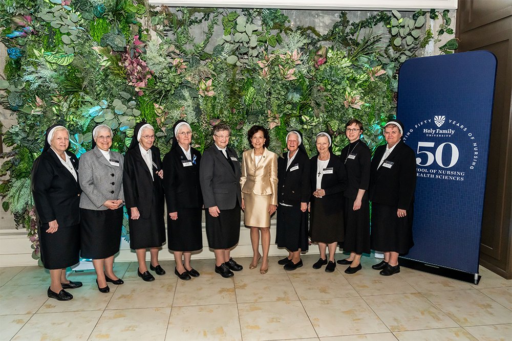 President Prisco with members of the The Sisters of the Holy Family of Nazareth