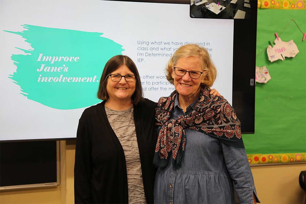 Holy Family University’s Dr. Roseanna Wright and Dr. Claire Sullivan smiling in classroom