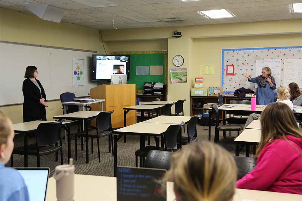 Holy Family University’s Dr. Roseanna Wright and Dr. Claire Sullivan lecturing together in class