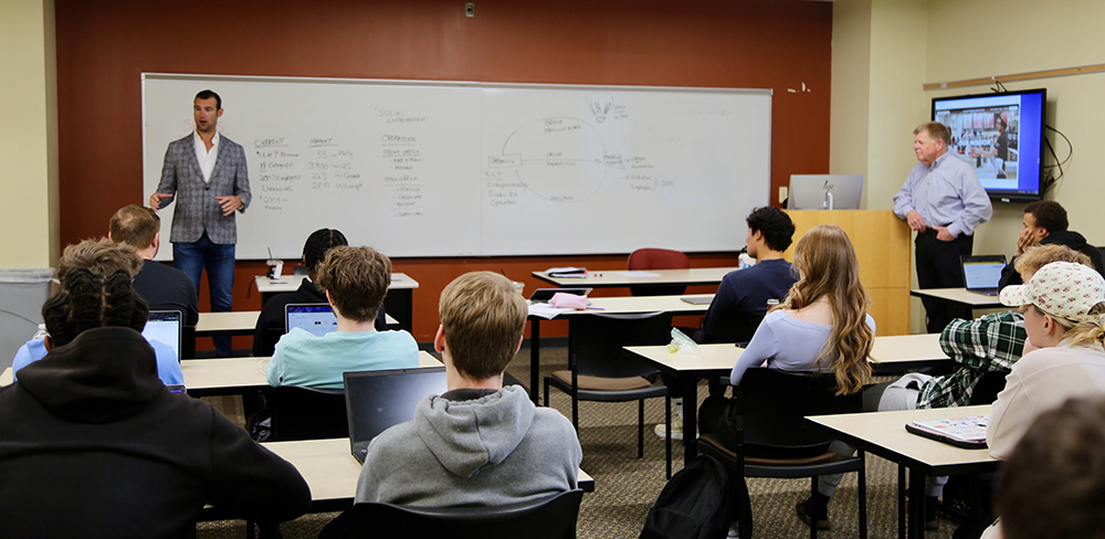 Nick Bayer speaking in classroom