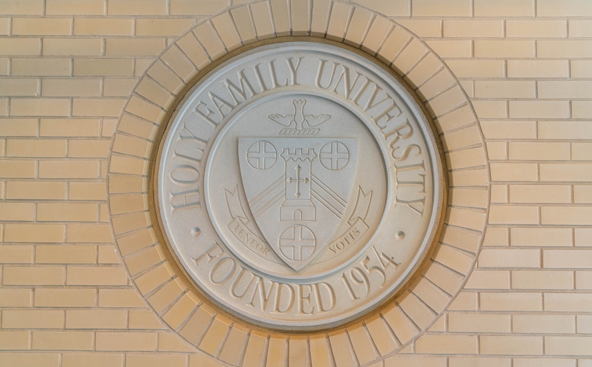 University Seal on brick wall