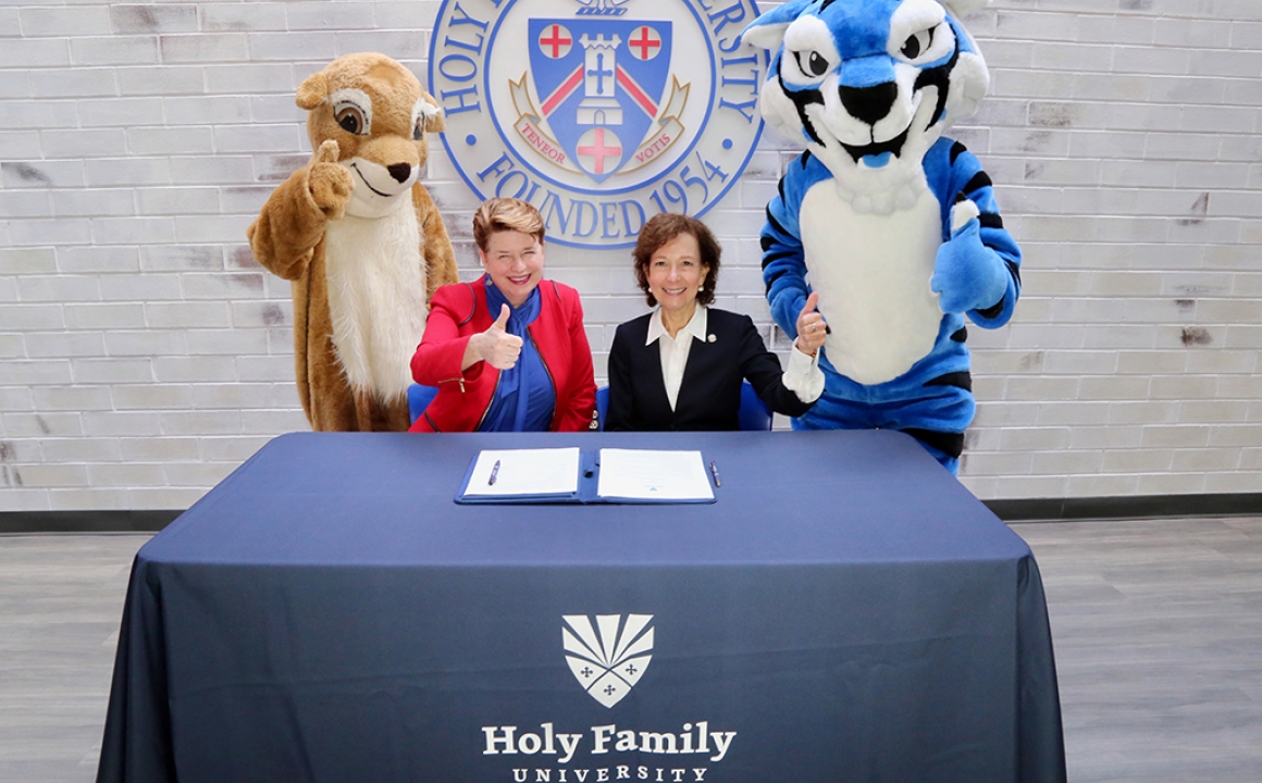 Anne Prisco, Ph.D., President of Holy Family University, and Lizanne Pando, Ed.D., President of St. Hubert Catholic High School For Girls with Mascots