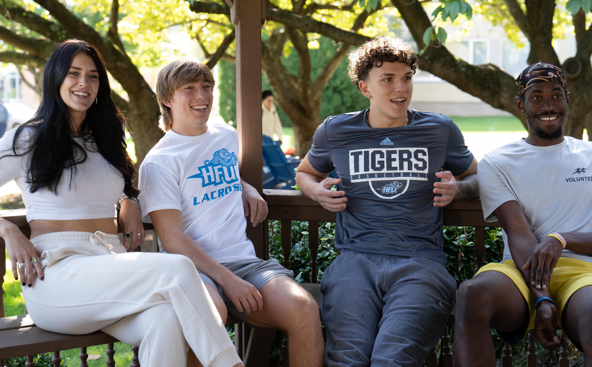 A group of students enjoying a nice day outside.