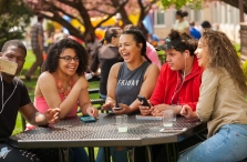 Students Sitting at Table in the Quad