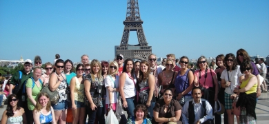 Holy Family University students post in front of the Eiffel Tower in Paris, France