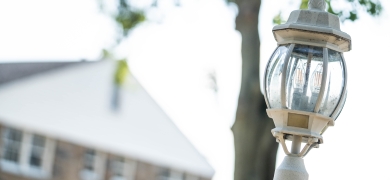 Lamp post and campus building