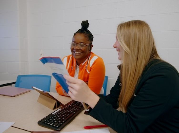 A tutor and a student review study materials