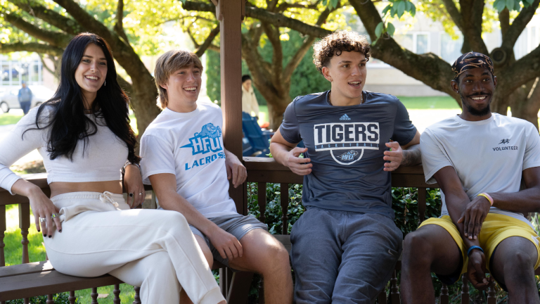 A group of students enjoying a nice day outside.