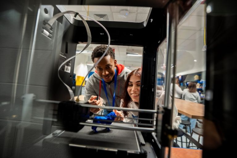 Two students working in a lab